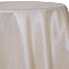 a white table cloth on top of a wooden table