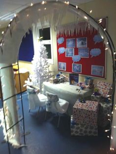 a room decorated for christmas with presents and decorations