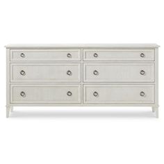 a white dresser with drawers and knobs on the bottom, in front of a white background