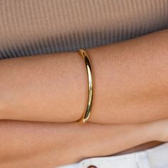 The Aris Hinge Bangle in gold and silver tones are a modern twist on the classic cuff, featuring an on-trend hinge design and endless styling possibilities. This bold bracelet is the perfect accent to your outfit and makes a statement wherever you go. It can be worn on its own, or stacked with other bracelets for added effect. Finish/Material: 18K Gold Over Brass ∙ Rhodium Over Brass Featuring a Minimalist 7 Inch Size Bangle | ~6mm Thick SKU: RR-BR033 Luxury Minimalist Gold Plated Bangle, Gold Hinged Bangle Bracelet, 14k Gold Hinged Bangle, Gold Tarnish-resistant Bangle, Gold Hinged Bangle, Sideways Initial Necklace, The Bangles, Gold Bangle, Hinged Bangle