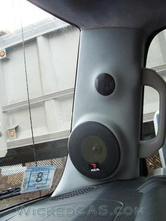 the interior of a vehicle with speakers on it