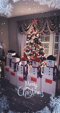 a christmas tree decorated with snowmen in front of a window