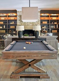 a pool table in the middle of a living room