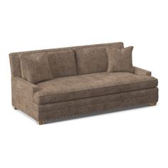 a brown couch sitting on top of a white floor