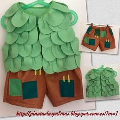 a green and brown outfit made out of paper with two different pockets on the front