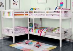 a white bunk bed sitting on top of a hard wood floor next to a rug