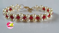 a white bracelet with red and white pearls on the front, and gold beads on the back