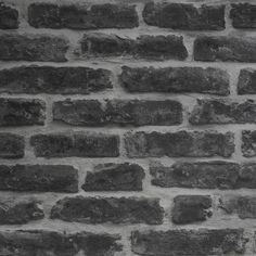 a black and white photo of a brick wall that has been made into a pattern