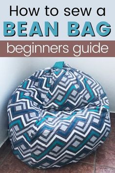 a bean bag sitting on the floor with text overlay reading how to sew a bean bag beginners guide