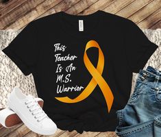 Multiple Sclerosis Shirt, This Teacher Is An MS Warrior Shirt, Multiple Sclerosis Awareness TShirt, Orange Ribbon MS Warrior T-Shirts * S I Z I N G * ✺ Sizing is unisex  ✺ For adults, size runs like men's, though not overly large. Most women find their typical size works best, since they are meant to fit a touch loose and go up 1 or 2 sizes if you want the oversized look. ✺ Size guide and fit:  The size chart is listed in photos above.  Please use the measurement for the most accurate sizing. * PRINT INFO * ✺ Printed with DTG - Direct to Garment Printing - which is different than vinyl heat press. With DTG, the image is transferred directly onto the fabric, which will give it a worn-in look. This makes the shirt less stiff than a traditional vinyl transfer and easy to care for. * S H I P P Ms Warrior, Awareness Tshirts, Multiple Sclerosis Awareness, Little Sister Gifts, Warriors Shirt, Orange Ribbon, Warriors T Shirt, Make Her Smile, Vinyl Transfer