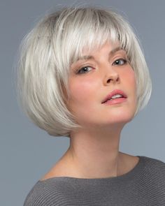 Estetica Wigs Fiber: Synthetic Hair Cap Size: Average Hair Length:Top 4" | Side 4" | Back 1.75" Weight: 2.89 oz This adorable page cut, has a shaped back and full bangs. Bob Ideas, Kort Bob, Wig Outlet, Ponytail Hair Piece, Best Wig Outlet, Full Bangs, Hair Patterns, Monofilament Wigs, Women's Wigs