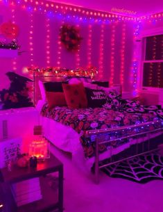 a bed room with a neatly made bed and lots of lights