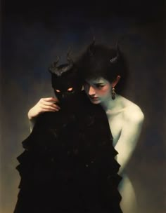 two women with black hair and horns on their heads, one is hugging the other