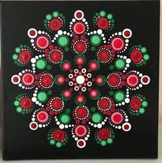 a black box with red, green and white designs on it