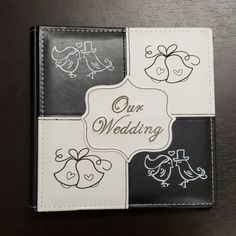 the wedding album is decorated with birds and flowers on it's cover, which reads our wedding