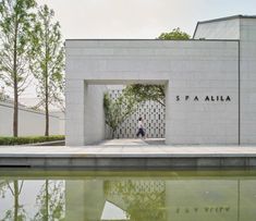 the entrance to spa allia is surrounded by water