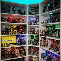 a room filled with lots of different types of action figures and figurines on shelves