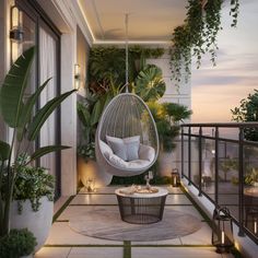 a hanging chair in the middle of a patio with plants and candles around it,