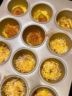 twelve cups filled with different types of food in them on a tray, ready to be cooked