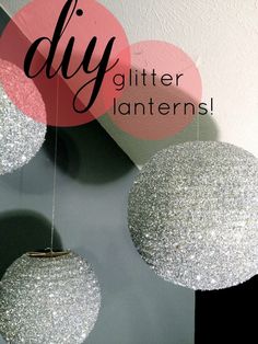 three glitter balls hanging from the ceiling in front of a sign that says diy