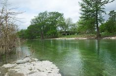 the water is so green that it appears to be very calm and still clear for us to see