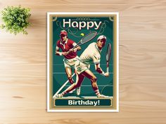 a birthday card featuring two tennis players on a wooden table with a plant in the background