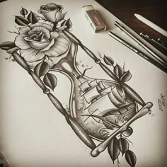 a pencil drawing of a rose and an hourglass with roses on the bottom half