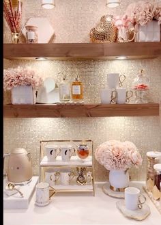 the shelves are filled with different types of perfumes and other things on display in front of them