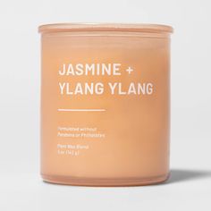 a candle with the label jasmine and ylang ylang on it