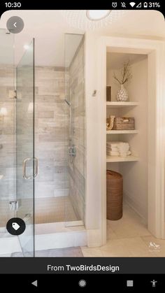 a walk in shower sitting inside of a bathroom