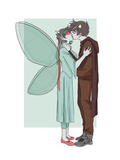 an image of a man and woman kissing in front of a fairy costume with wings