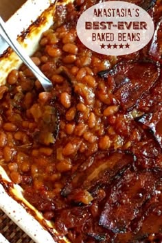 baked beans in a white casserole dish with a spoon on top and the words anatassia's best - ever baked beans above it