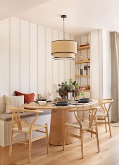 a dining room table with chairs around it