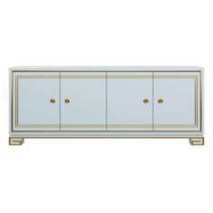 a white and gold sideboard with three doors