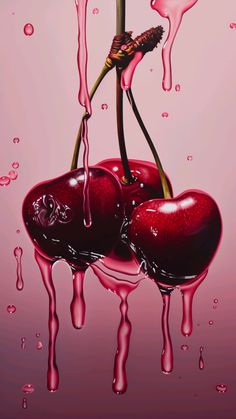 two cherries are dripping in pink liquid on top of each other, and one is holding a flower