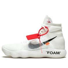 a white sneaker with black and red accents on the side, in front of a white background