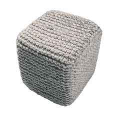 a gray knitted stool cushion on a white background with room for text or image