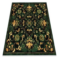 a green rug with gold accents on it