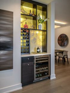 a wine cellar in the corner of a room