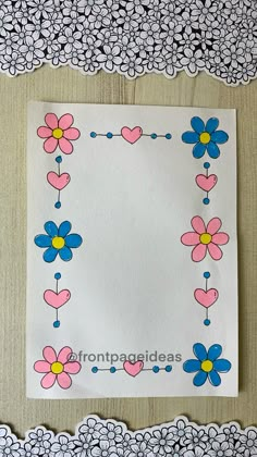 a piece of paper with flowers and hearts on it next to a doily border