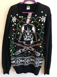 a darth vader christmas sweater hanging on a wall