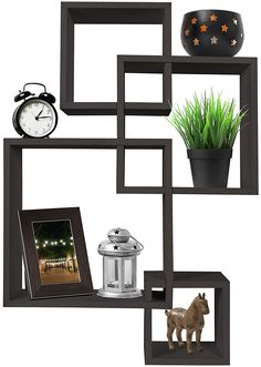 an assortment of items displayed on shelves with a clock, potted plant and photo frame