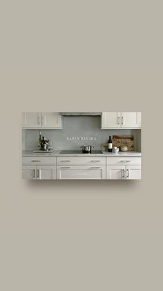 a kitchen with white cabinets and countertops on a gray wall above it is the words family panoramic