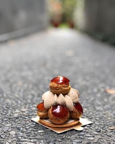 there are donuts stacked on top of each other in the middle of the street