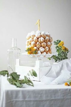 there is a cake on the table with flowers