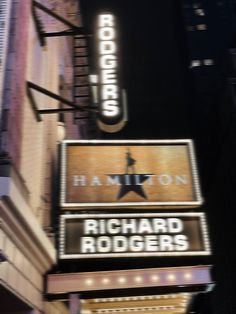 the marquee for richard roger's hollywood theater is lit up