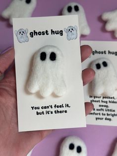 someone is holding up some fake ghost magnets