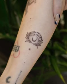 a woman's arm with a tattoo on it and a clock in the middle