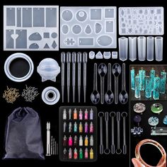 an assortment of crafting supplies including scissors, beads, and other items on a black background