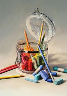 colored crayons and pencils in a glass jar